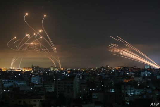 The Iron Dome in action. On the right are missiles launched from Gaza while, on the left, Iron Dome missiles intercept them over the State of Israel.